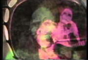 Transposed image of a skeleton (calevera) over a grinning skull