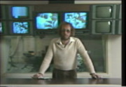 Man standing in front of tv screens